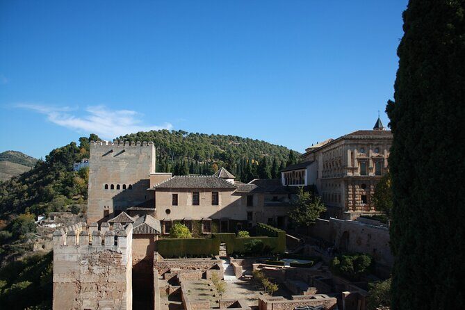 Full-Day Alhambra from Malaga: Choose Your Access & Pick Up Point - The guides: what to expect from the official storytelling