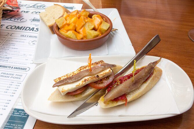 Malaga Food Tour: Tapas, Drinks and Delights with a Local - Plaza de la Merced: Roman-square views plus berenjenas al miel