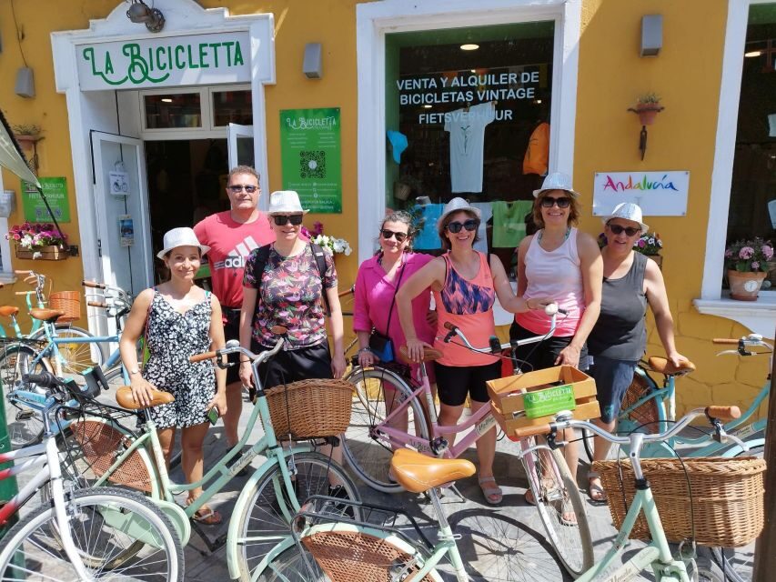Malaga: Guided Bike Tour - Muelle Uno to La Farola: Port views and a whitewashed lighthouse