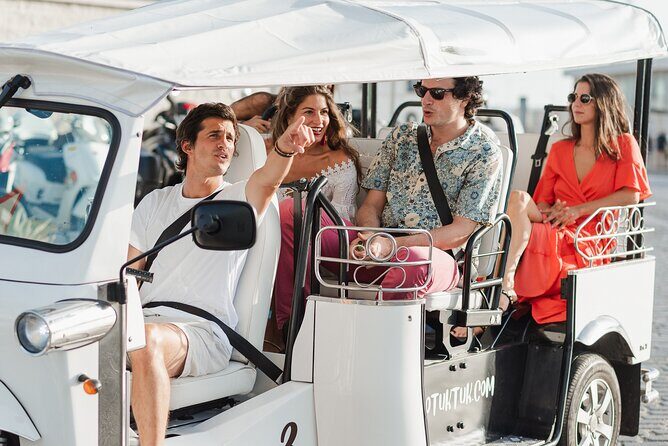 Malaga Welcome Tour with Local Guide in Eco Tuk Tuk Private - La Malagueta Beach: Urban Sands Between the Port and Caleta